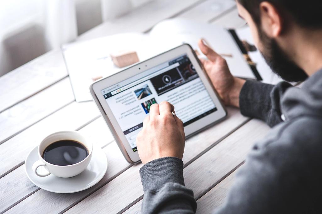 People using digital devices and technology in modern workspace